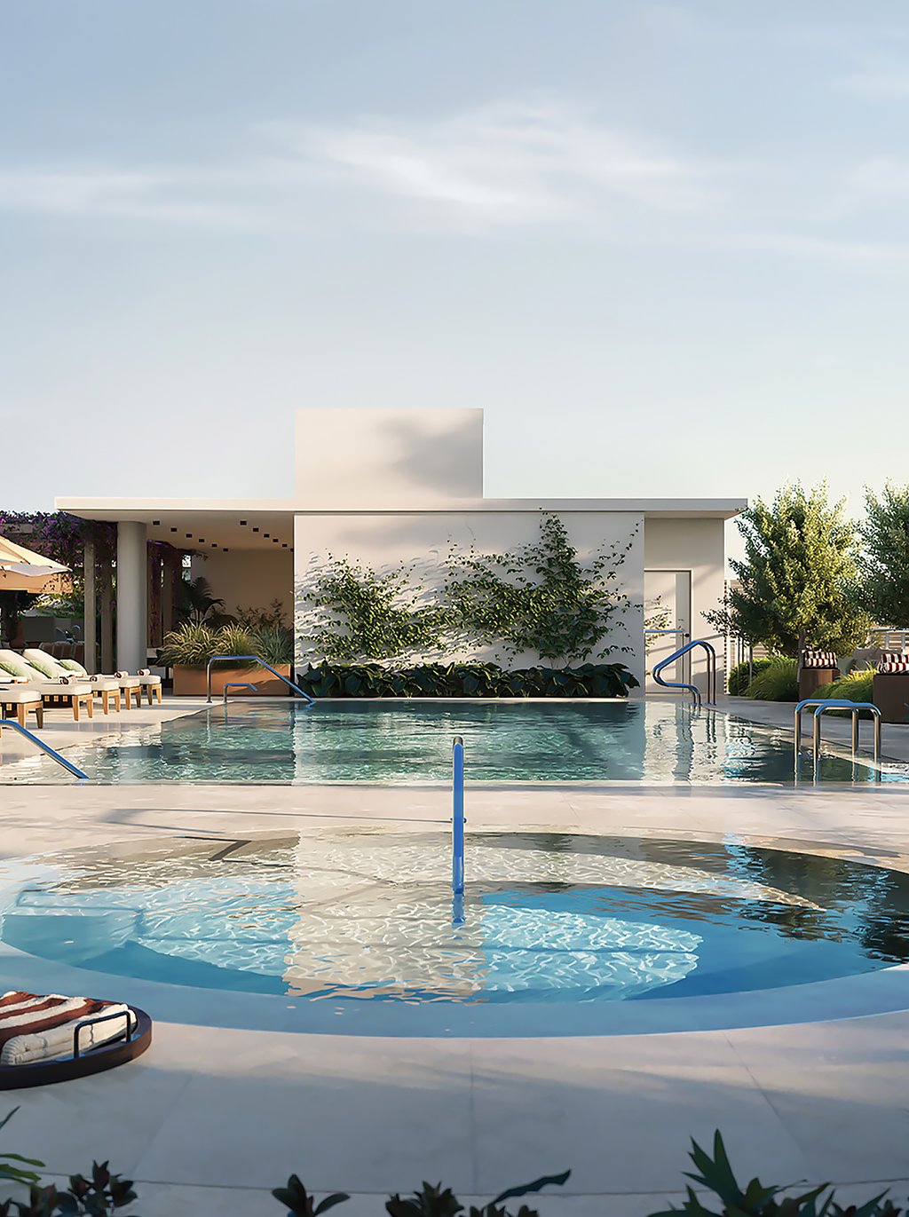 On the rooftop, two rejuvenating pools promote holistic health. A spacious low-toxin lap pool helps reduce skin irritation, while lap swimming increases lung capacity, lowers blood pressure, reduces stress, supports mental health, improves sleep patterns, and more. The circular heated pool helps relax muscles and joints post-swim and improves blood circulation.