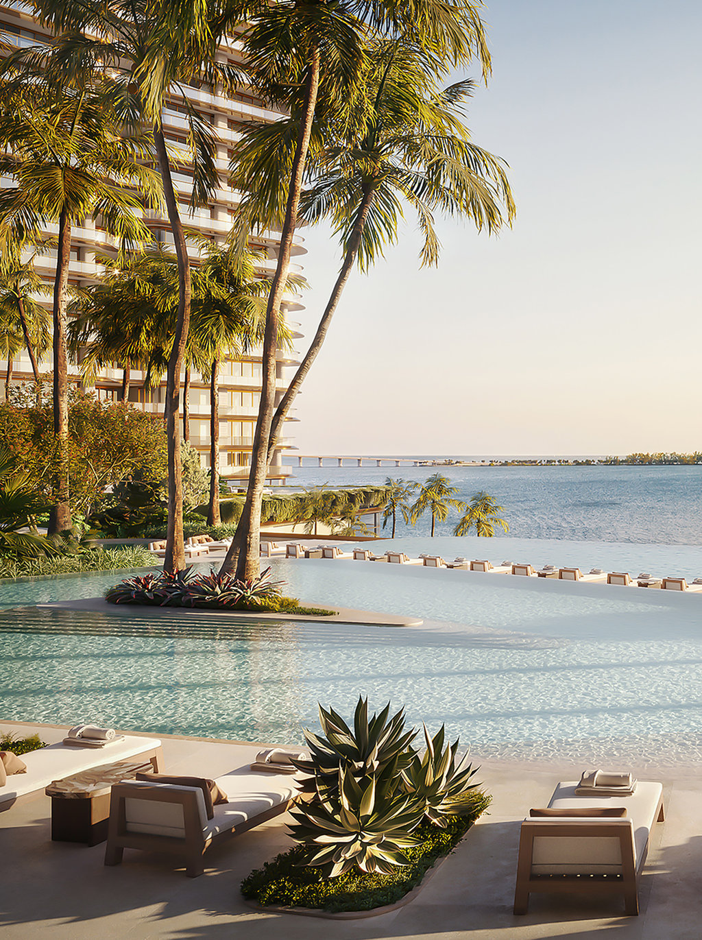 The property boasts a series of infinity swimming pools, providing a serene oasis for relaxation and leisure. These elegantly designed pools, surrounded by lush greenery, create an idyllic environment where residents can unwind while enjoying the seamless blend of land and sea.