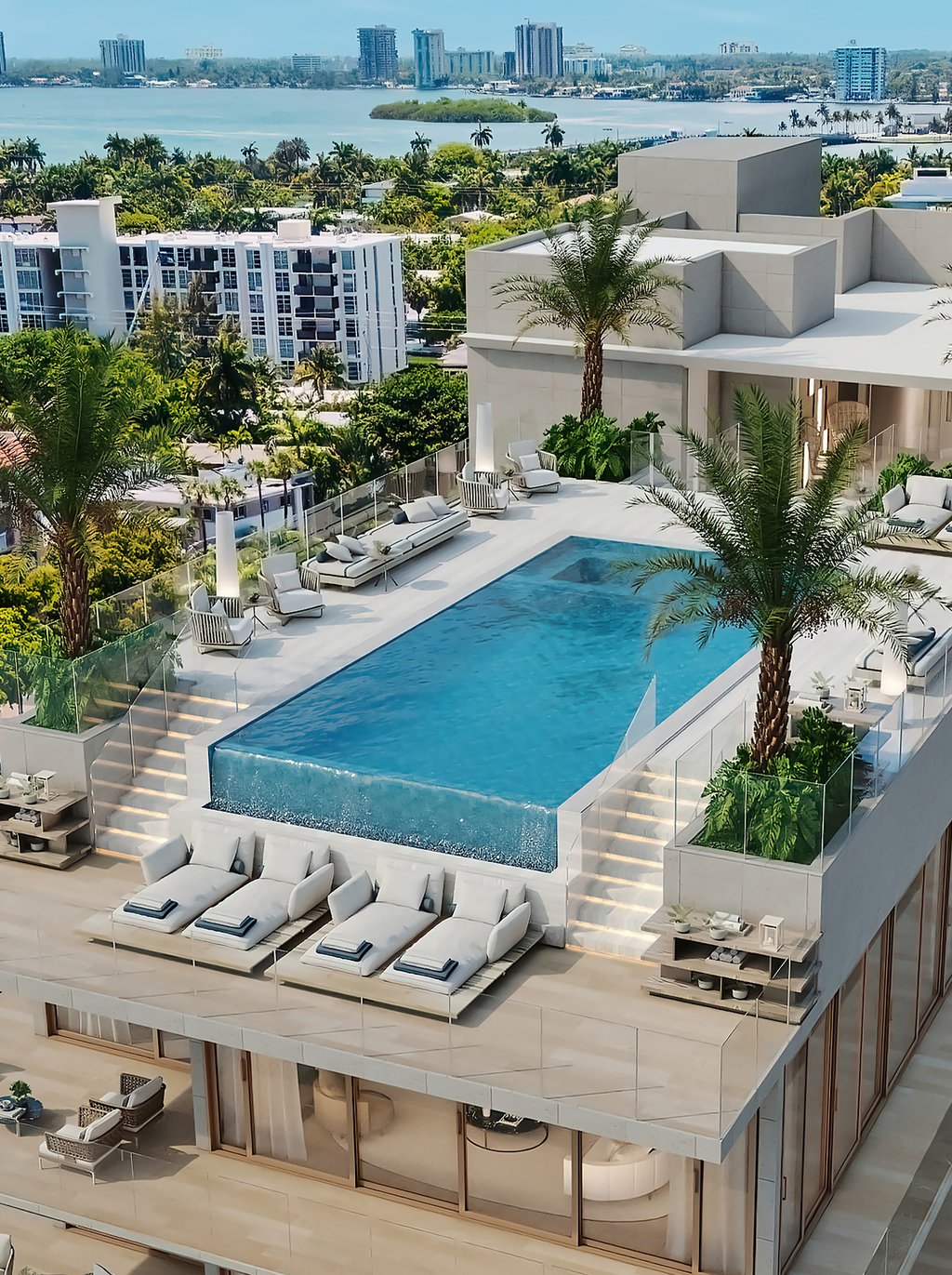 This remarkable space features a sparkling pool, jacuzzi, lounge chairs, daybeds, outdoor kitchen, and bar, creating the ultimate setting for relaxation and entertainment. With panoramic views of the city skyline and the bay, the rooftop pool deck is the ideal place to socialize with friends and family or simply soak up the sun in style.