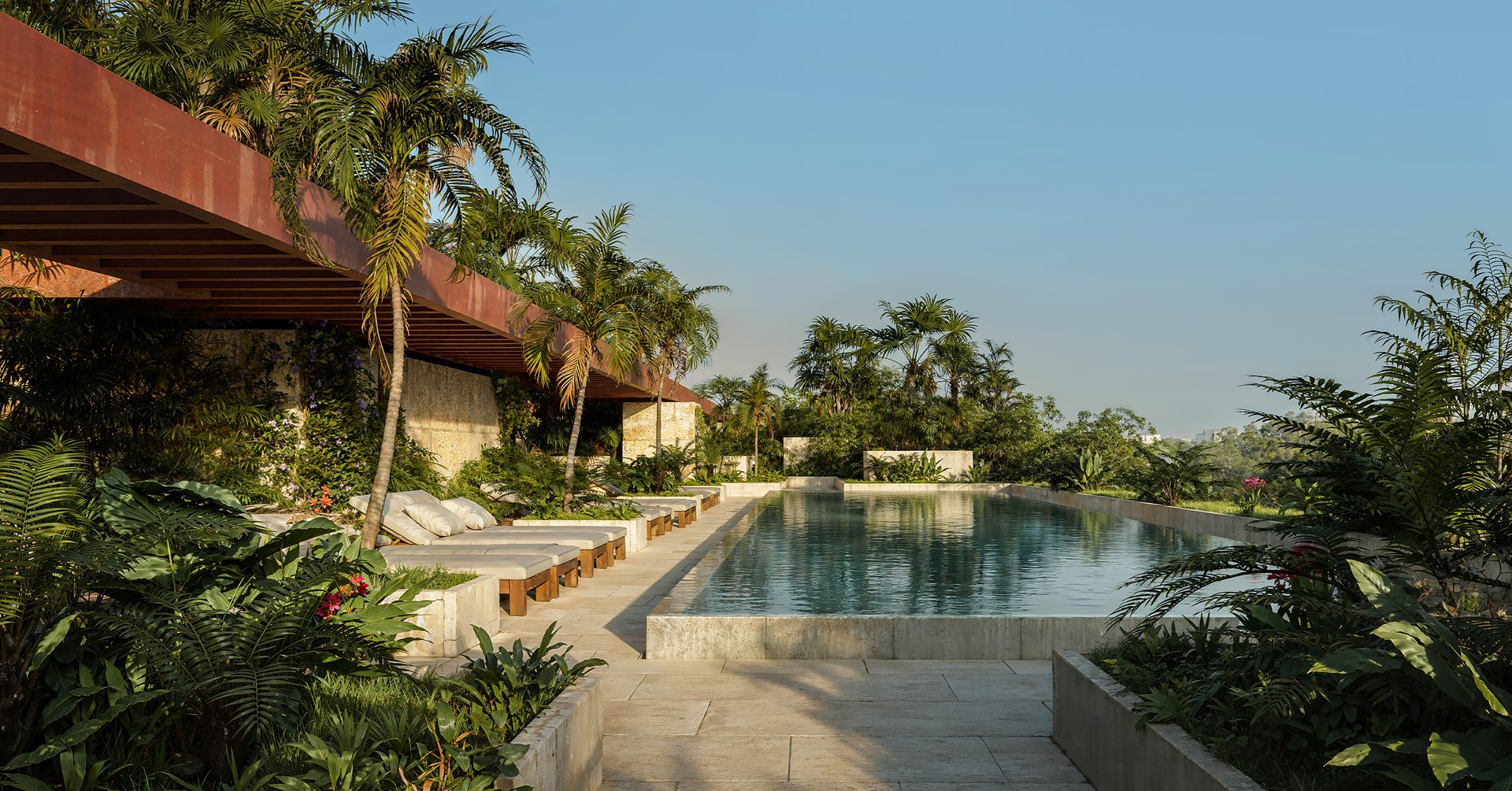 The Residences at Ziggurat feature an expansive rooftop oasis. This amenity includes a resort-style pool, a hydrotherapy circuit for relaxation, chef's grilling stations for outdoor cooking, and private cabanas for secluded lounging.