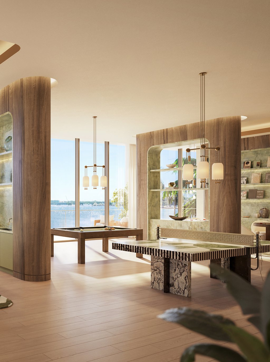 A refined social lounge designed for friendly competition and effortless entertaining, featuring elegant gaming spaces in a relaxed setting overlooking the waterfront.
