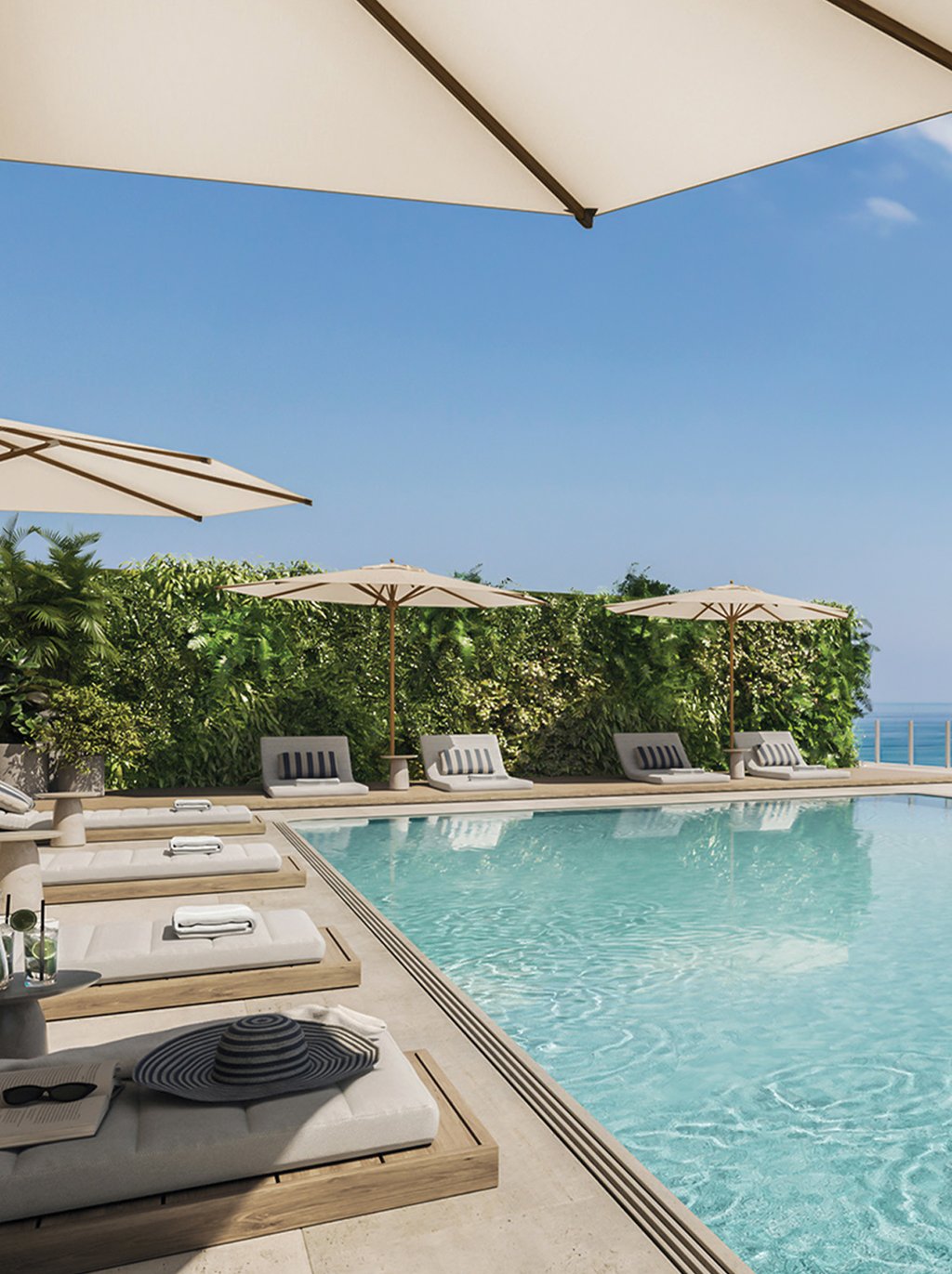 Located on the rooftop of the building, the pool deck includes several outdoor areas to enjoy a sunny day or relax by the majestic views.